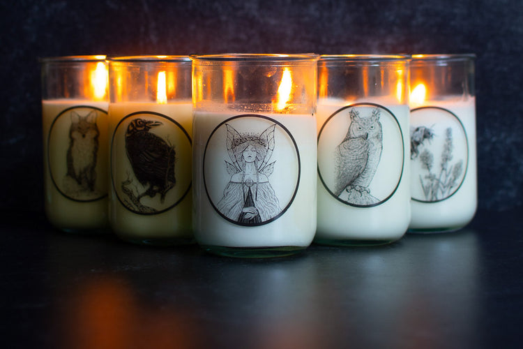 Sea Witch Botanicals 5 signature scent candles burning