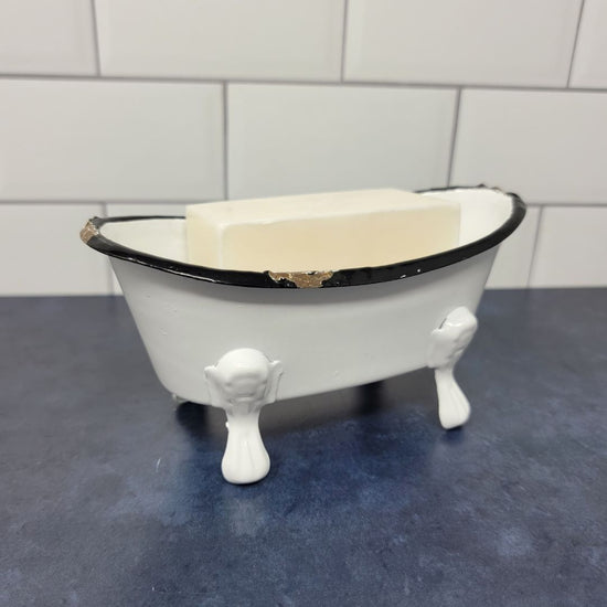 Rustic clawfoot bathtub soap dish with soap