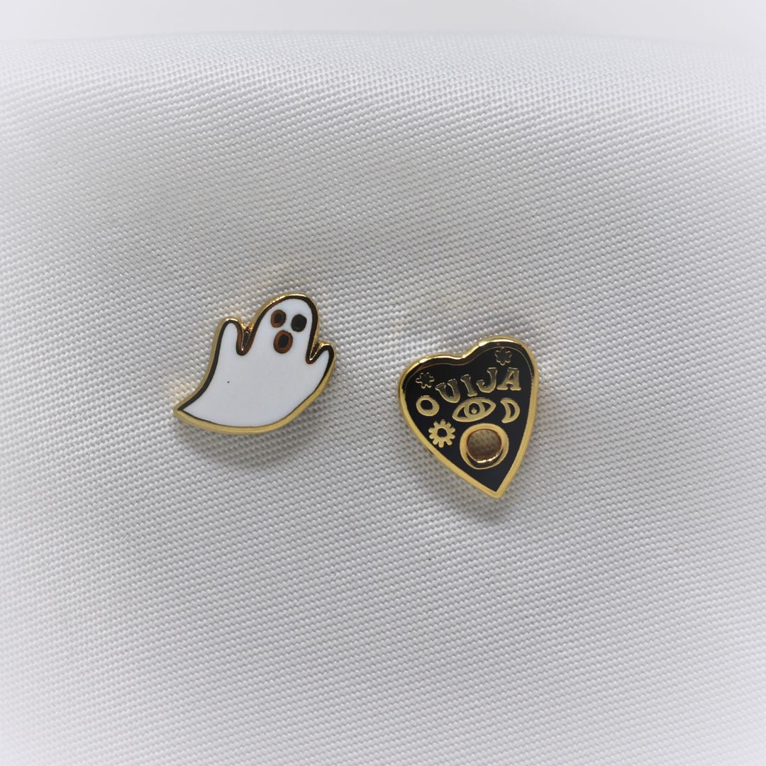 Yellow Owl Workshop Earrings - Mismatched Studs. One is a ghost and the other is a ouija board planchette.